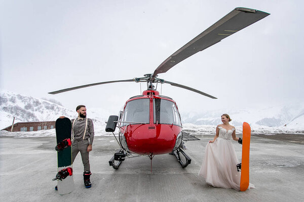 Bride Groom Standing Both Sides Red Helicopter Each Own Snowboards Stock Image