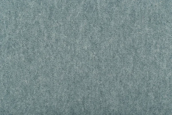 Blå fluffigt material på nära håll. Stickad texturbakgrund — Stockfoto