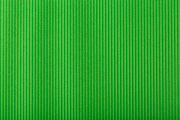 Dikey çizgileri olan soyut yeşil arkaplan. Kopya alanı ile desenli arkaplan. Corrugated paper top lay, web sitesi veya afiş şablonu konsepti