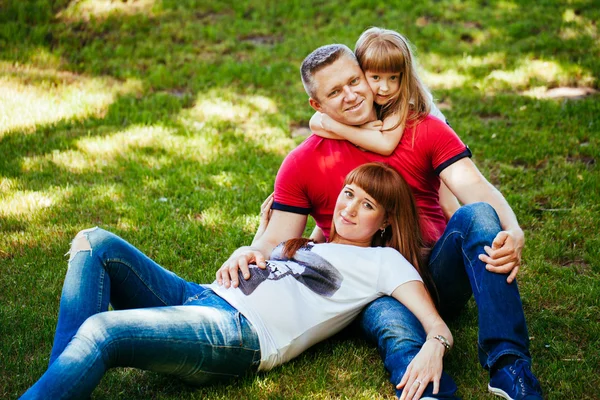 A young family, a pregnant mother, father, daughter — Stock Photo, Image