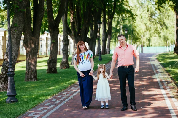 A young family, a pregnant mother, father, daughter — Stock Photo, Image