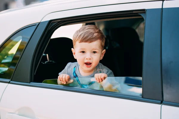 Adorable baby boy in the car — Stock Photo, Image