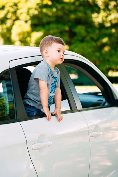 Adorable baby boy in the car — Stock Photo, Image