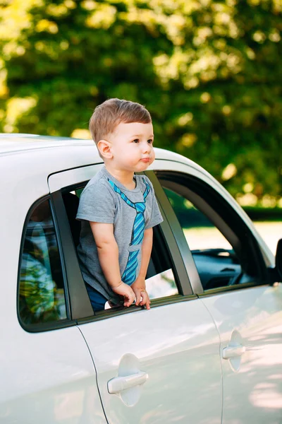 Adorable baby boy in the car — Stock Photo, Image