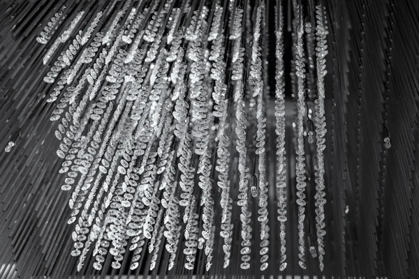 Decorative crystal chandelier on the ceiling