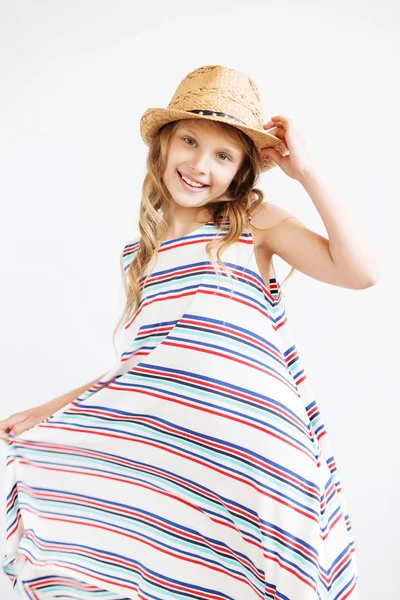 Lovely little girl with straw hat against a white background. — Stock Photo, Image