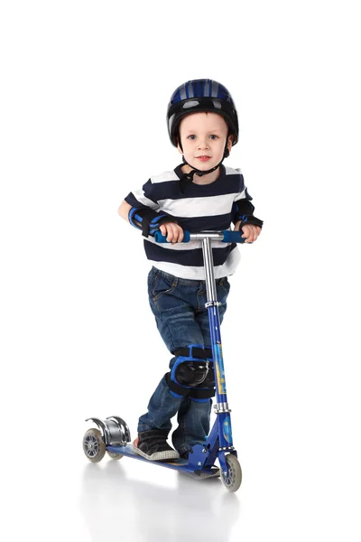 Little boy in protection helmet and in the knee and arm ruffles — Stock Photo, Image