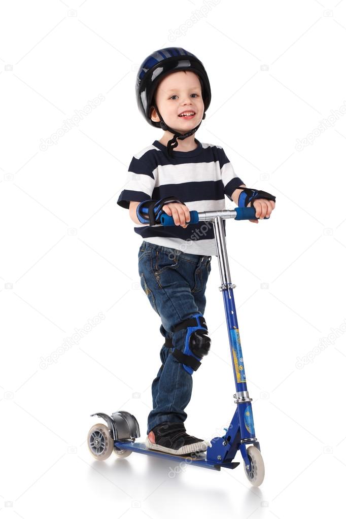 Little boy in protection helmet and in the knee and arm ruffles