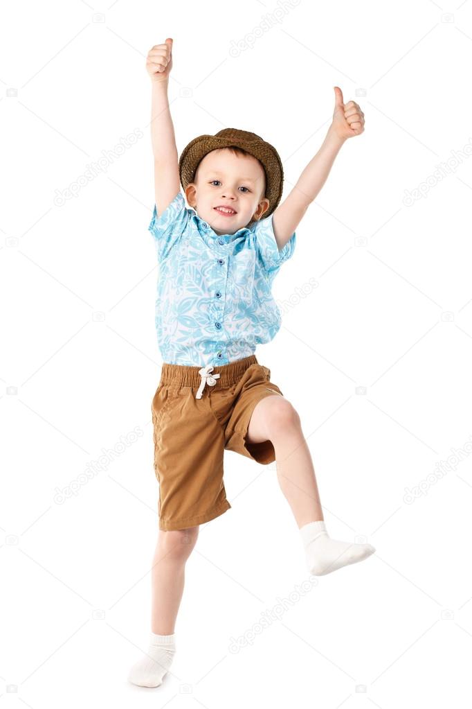 Little boy jumping and having fun isolated on white background.