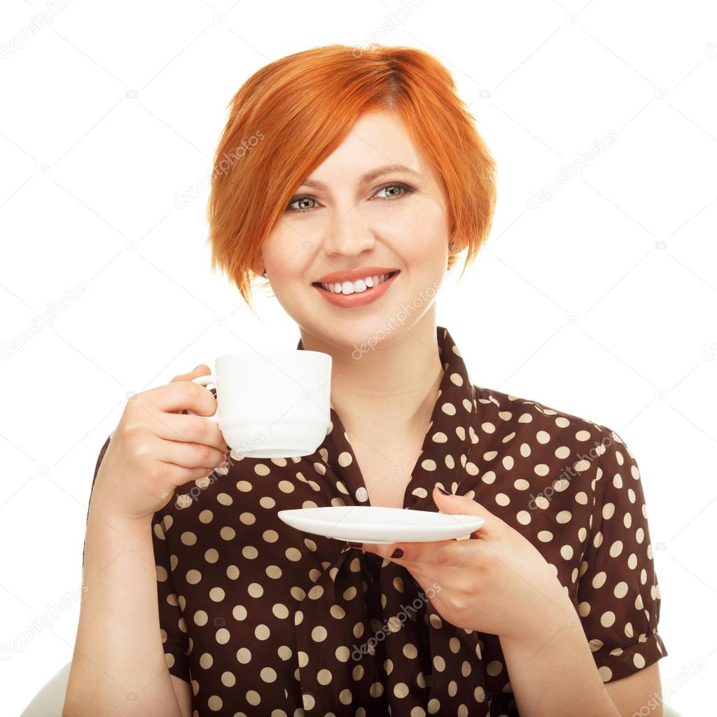 smiling young woman drinking from a cup