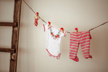 Things for the newborn hanging on rope clipart