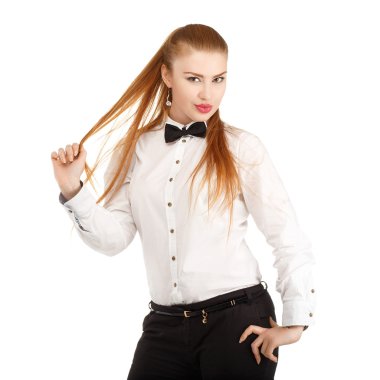 Portrait of beautiful young woman in strict clothing with bow ti