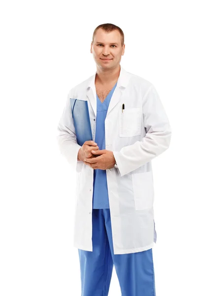 Portrait of a young male doctor in a white coat and blue scrubs — Stock Photo, Image