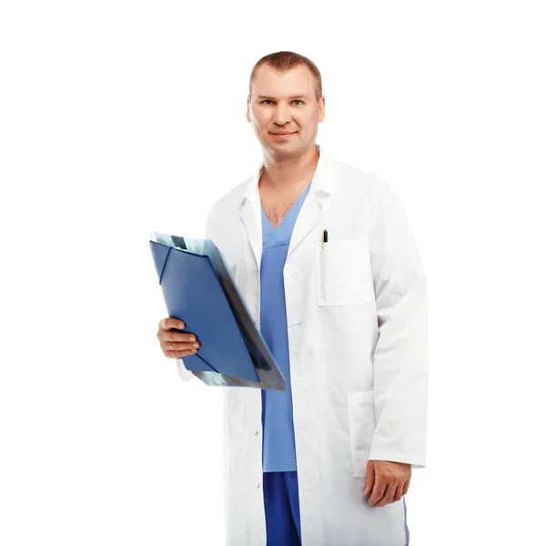 Portrait of a young male doctor in a white coat and blue scrubs — ストック写真