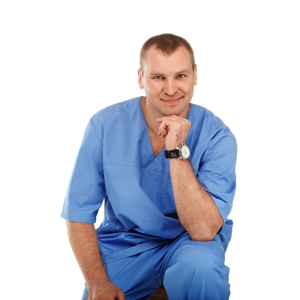 Portrait of a young male doctor in a medical surgical blue unifo — ストック写真