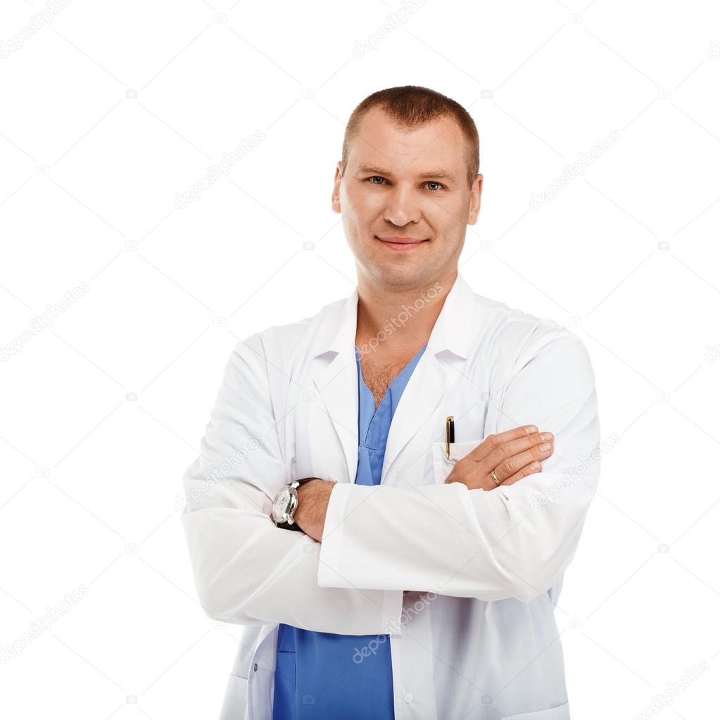 Portrait of a young male doctor in a white coat and blue scrubs