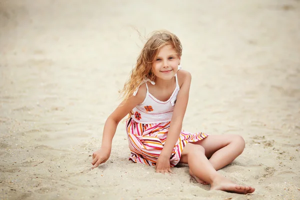 Portrait of a pretty little girl with waving in the wind long ha — Stock Photo, Image