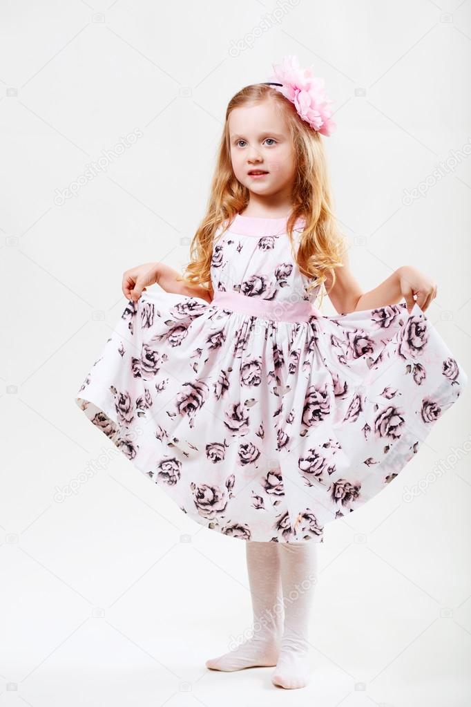 Full length portrait of a cute little dancing girl