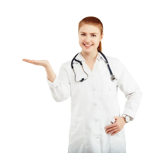 Portrait of a young female doctor in a white coat holding in han — Stock Photo, Image