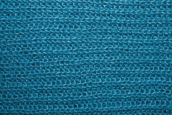 Μπλε αφράτο επιχρισμένη κλωστή πουλόβερ ως φόντο. — Φωτογραφία Αρχείου