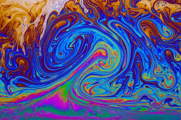 Psychedelic abstract formed by light interference on the surface of a soap bubble