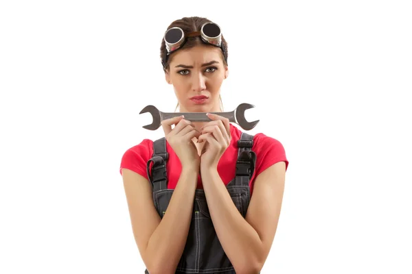 The girl stands with a wrench — Stock Photo, Image