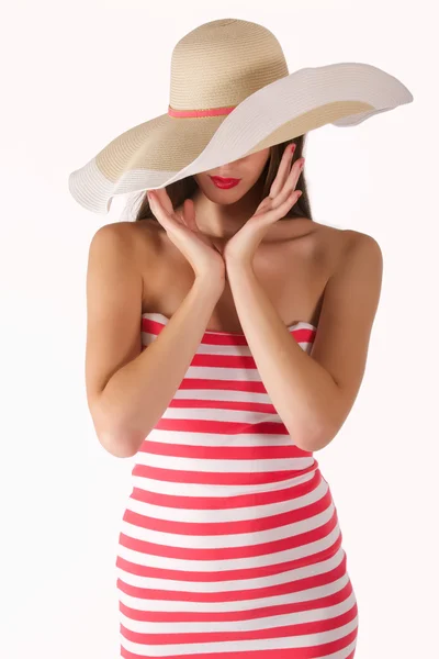 Girl in a striped dress and hat — Stock Photo, Image