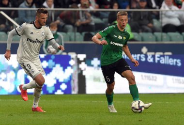 WARsaw, POLAND - SEPTEMBER 19, 2021: Legia Warszawa - Gornik Leczna, Tomas Pekhart (Legia Warszawa) Janusz Gol (Gornik Leczna) 