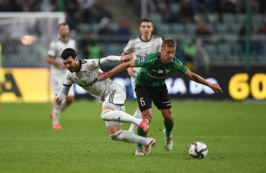 WARsaw, POLAND - SEPTEMBER 19, 2021: Polonya Futbol Ligi oyunu Legia Warszawa - Gornik Leczna, Mahir Emreli (Legia Warszawa) Janusz Gol (Gornik Leczna) 