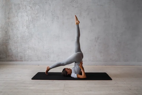 Woman Practicing Advanced Yoga on Organic Mat. Series of Yoga
