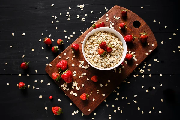 Healthy breakfast, muesli, granola with strawberries, health and diet concept. Top view point. — Stock Photo, Image