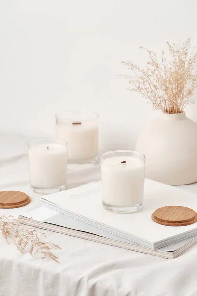 Handmade scented candles in a glass with a wooden lid. Soy wax candles with a wooden wick.