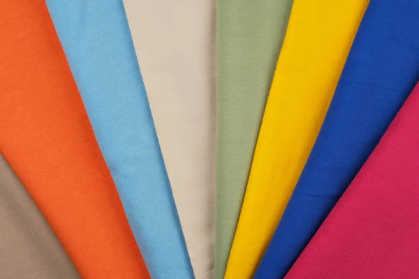 Fondo de diferentes colores de tela. Material para coser. — Foto de Stock
