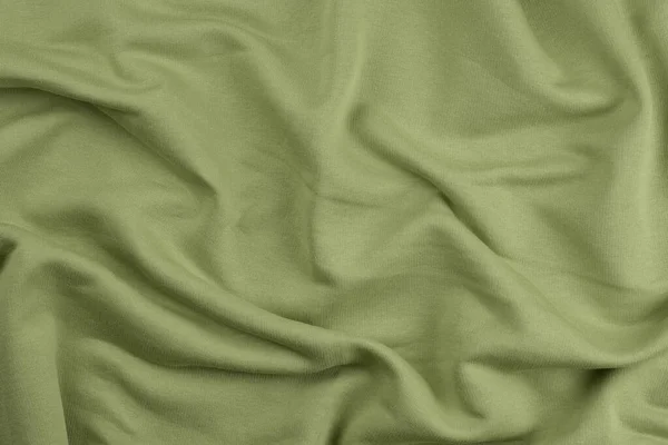 Фон из зеленой монохромной хлопковой ткани. Закрыть текстуру — стоковое фото