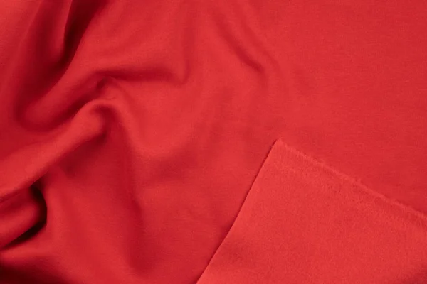 Achtergrond van rood monochroom katoenen weefsel. Close-up textuur — Stockfoto