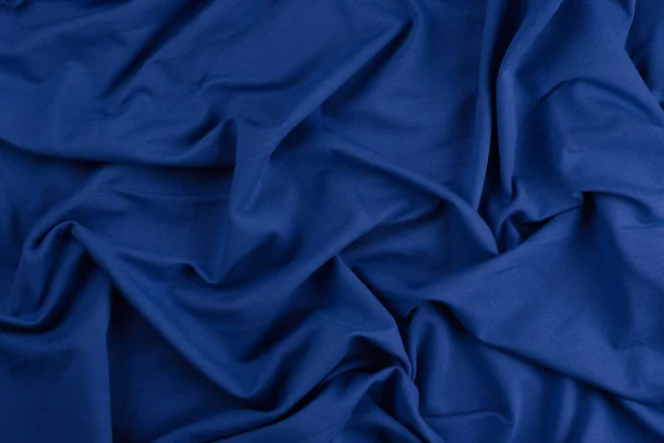 Φόντο από μπλε μονόχρωμο βαμβακερό ύφασμα. Κοντινή υφή — Φωτογραφία Αρχείου