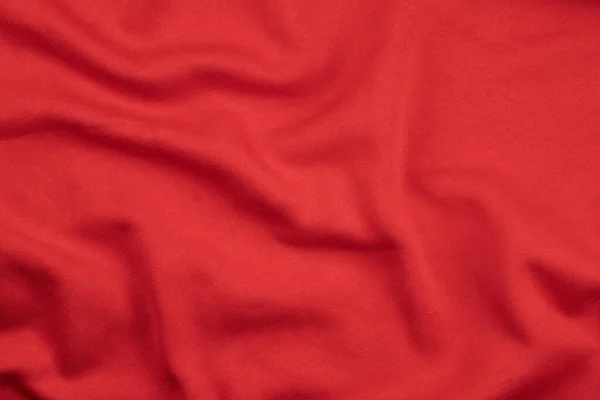 Pozadí z červené monochromatické bavlněné tkaniny. Zavřít texturu — Stock fotografie