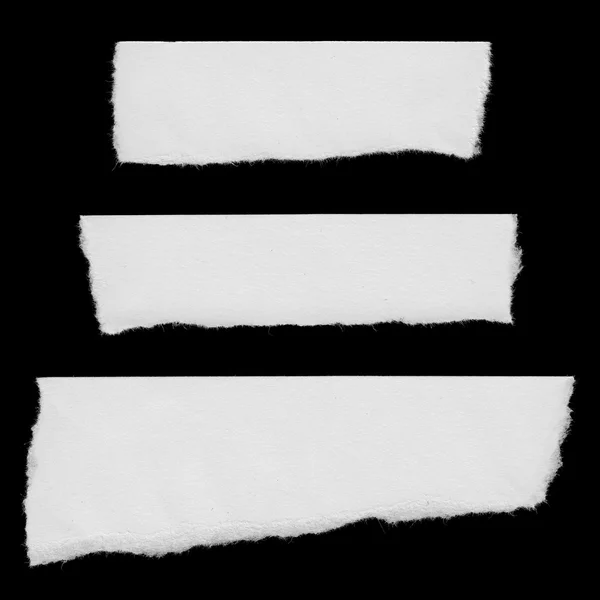 Tiras rasgadas de papel branco isoladas em fundo preto — Fotografia de Stock