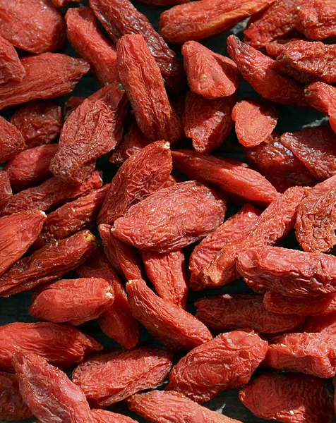 Kurutulmuş goji meyveleri kapatın. Goji meyveleri arka plan.