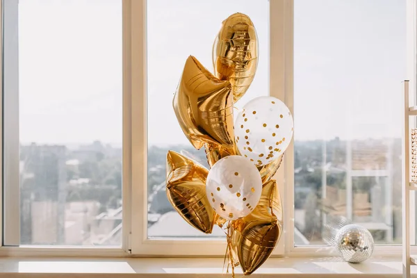 close-up shot of golden decor balloons indoor