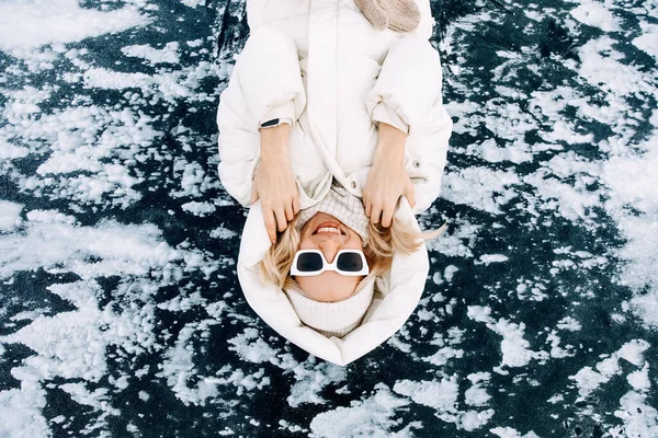 Blonde Young Woman Wearing Duck Jacket Lying Ice Frozen Lake — Stock Photo, Image