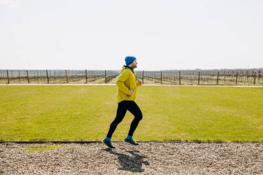 Man jogging in backyard