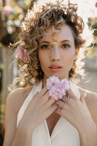 Closeup Portrait Young Woman Curly Hair Posing Outdoors Pink Flowers — Foto de Stock