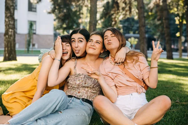 Group Four Women Friends Sitting Park Hugging Laughing Concept Female — Fotografia de Stock