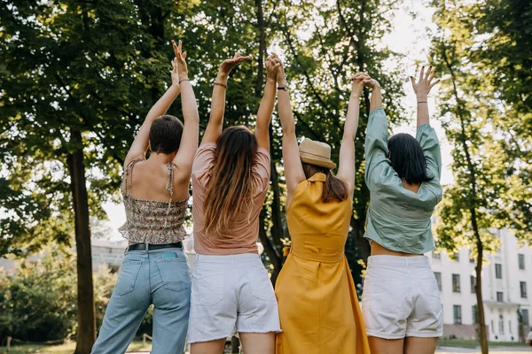 Group Four Women Outdoors Having Good Time Holding Hands Together — Φωτογραφία Αρχείου