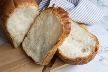 sliced of home made white bread, frtesh from oven