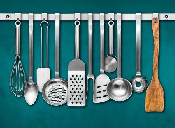 Metal rail with kitchen tools — Stock Photo, Image