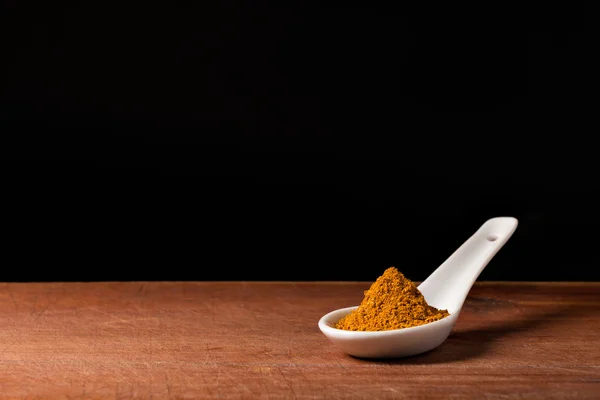 Curry powder on a spoons — Stock Photo, Image