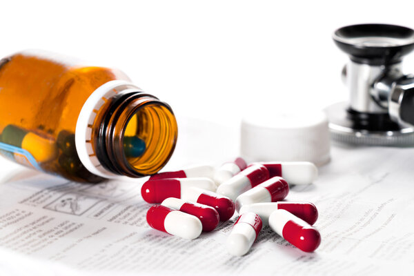 Tablets and stethoscope on the table