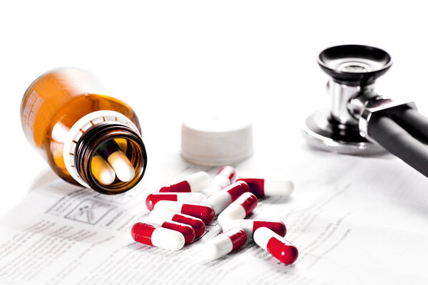 Tablets and stethoscope on the table